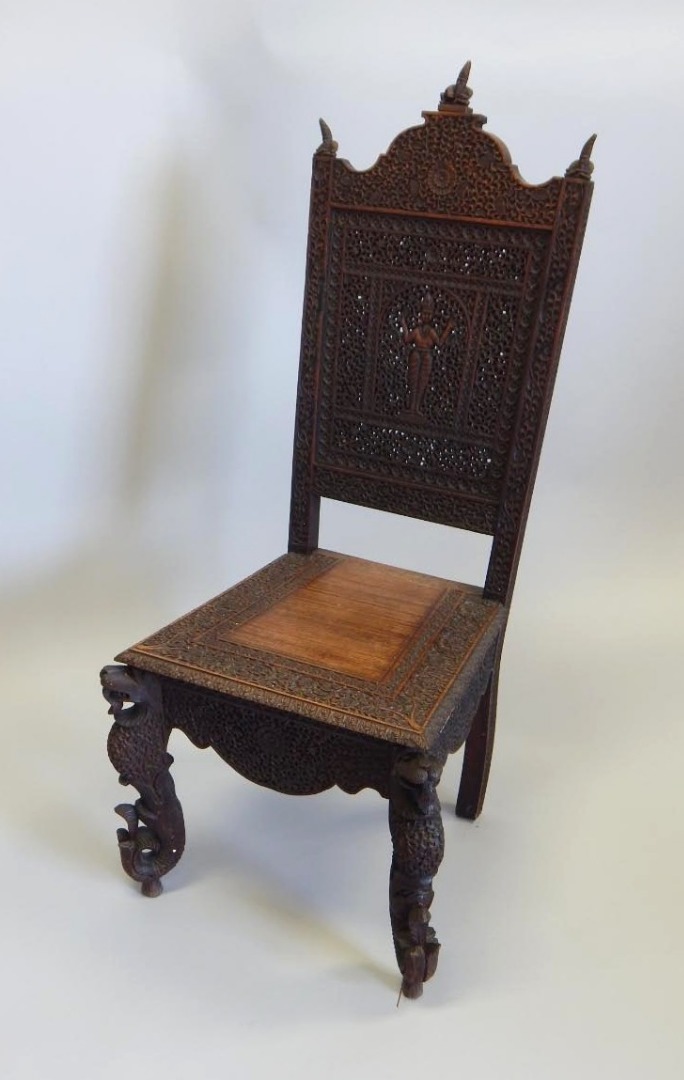 Appraisal: A Burmese carved hardwood side chair the back decorated with