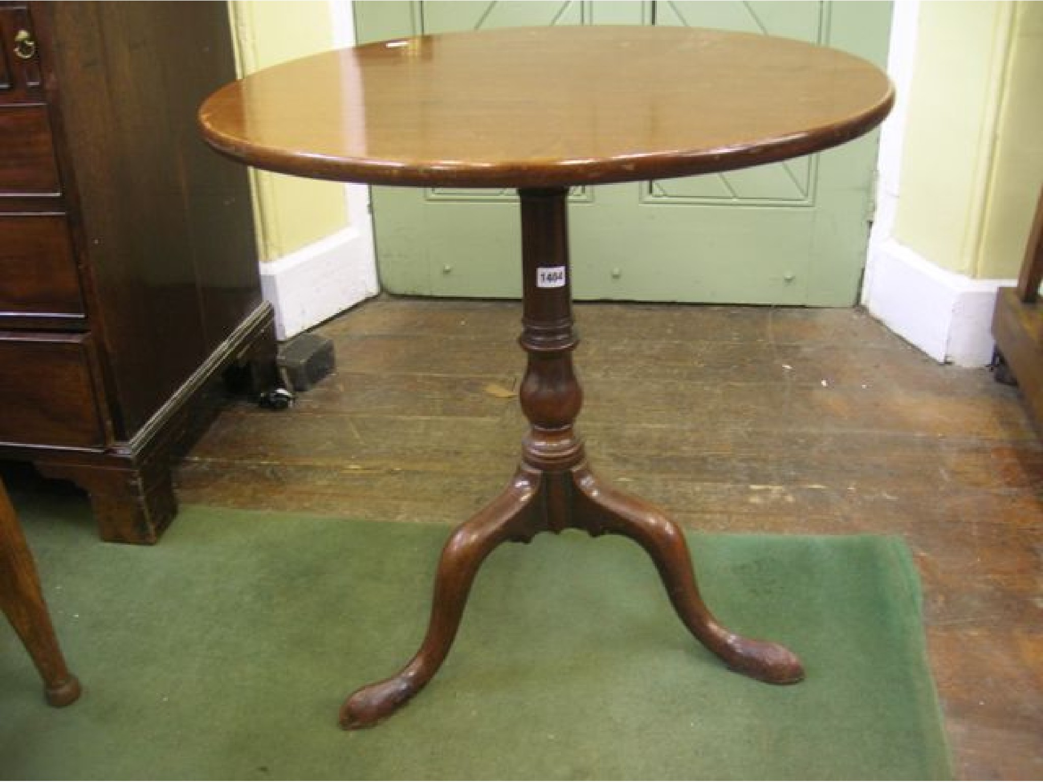 Appraisal: A Georgian mahogany snap top occasional table on a canon