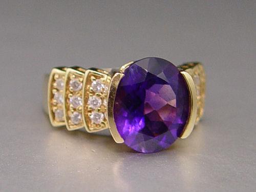 Appraisal: CT AMETHYST WITH DIAMONDS RING K yellow gold ring centers