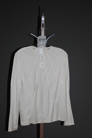 Appraisal: CHADO ivory silk long sleeve knit top w piping back