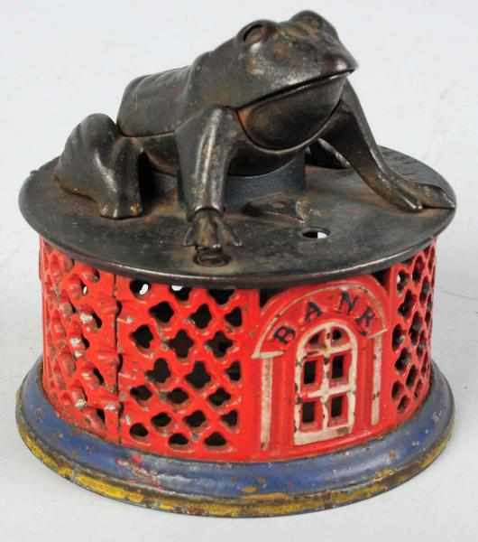 Appraisal: Cast Iron Frog on Lattice Mechanical Bank Manufactured by J