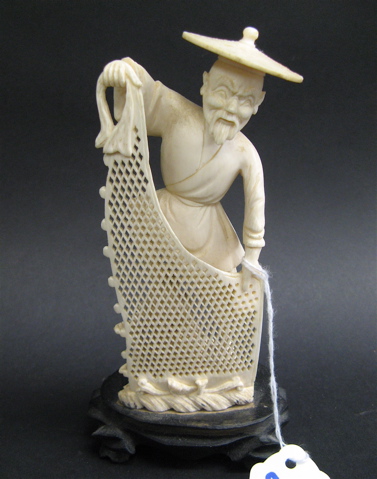 Appraisal: IVORY FIGURE OF A CHINESE FISHERMAN holding a small hand