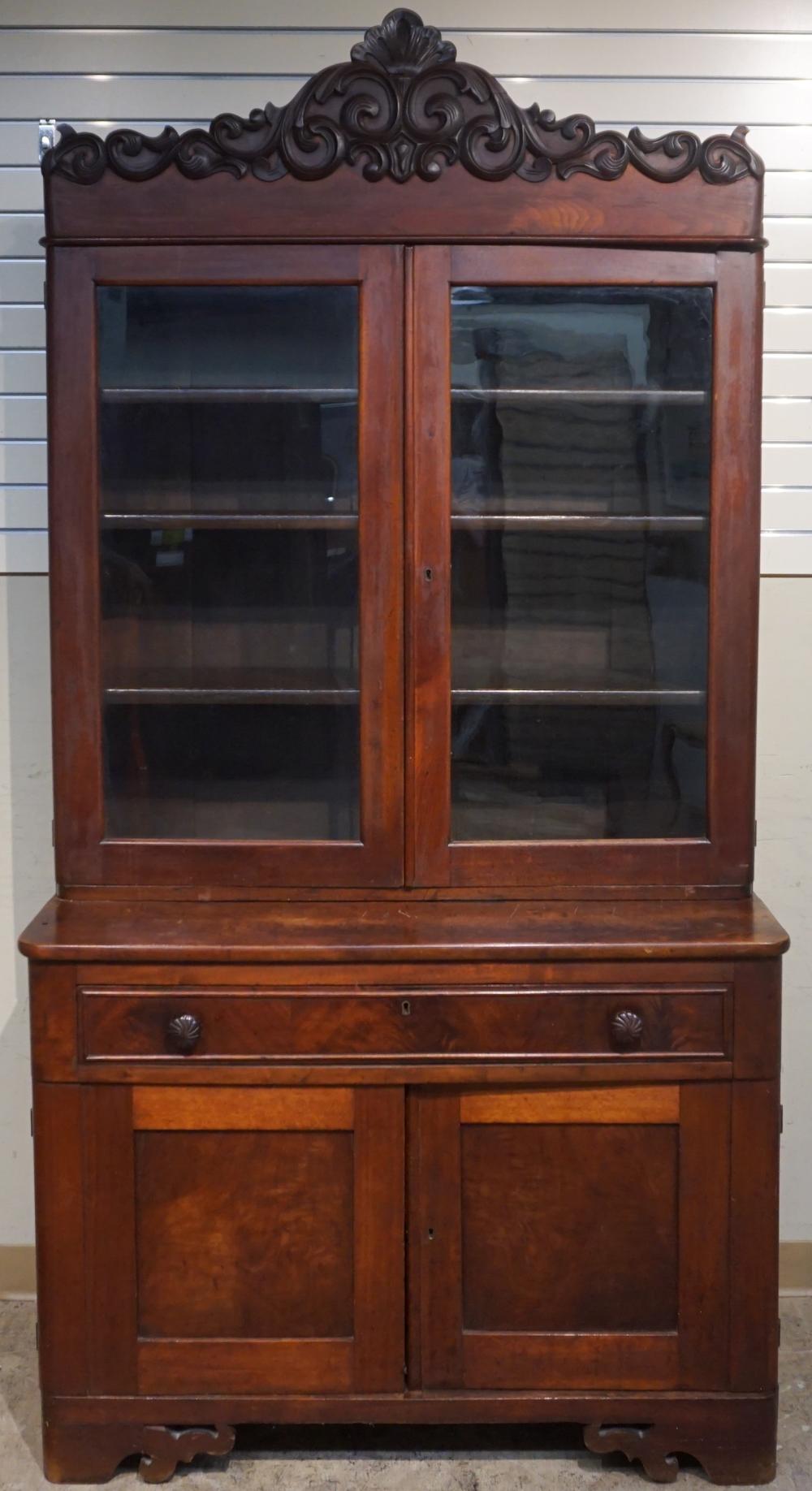 Appraisal: VICTORIAN ROCOCO STYLE MAHOGANY TWO-PART BOOKCASE AND CABINET MID- TH