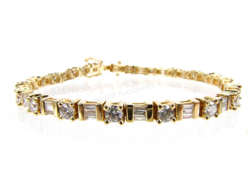 Appraisal: A K yellow gold tennis bracelet long with nineteen round