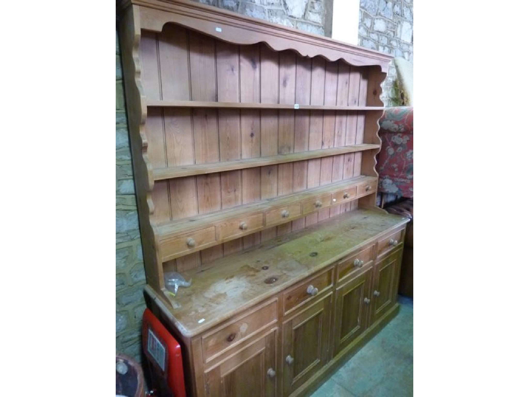 Appraisal: A stripped pine kitchen dresser the base enclosed by four