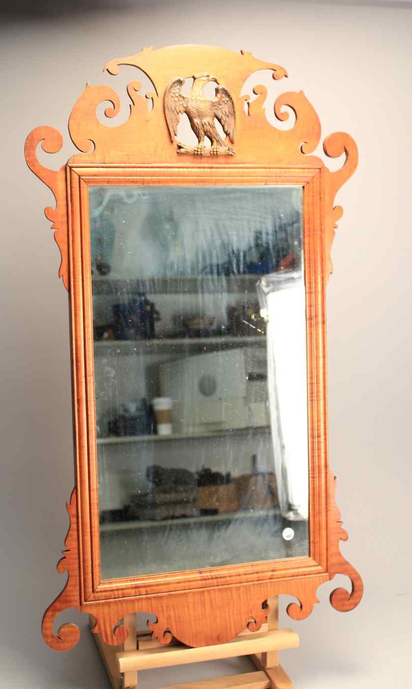 Appraisal: CHIPPENDALE-STYLE MIRRORIn curly maple Crest with raised carved and pierced