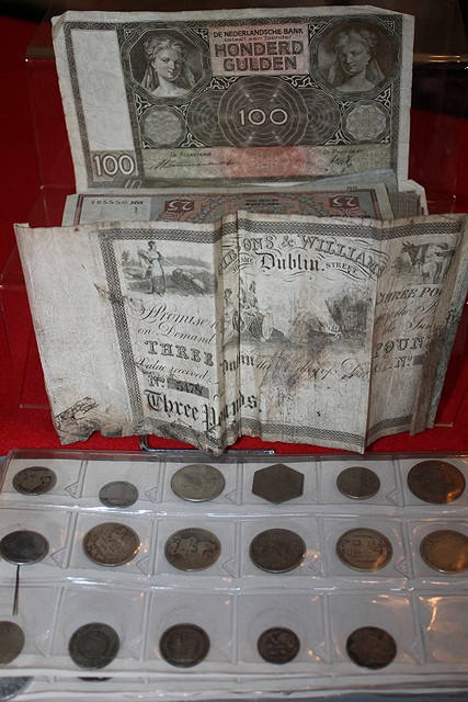 Appraisal: AN ALBUM OF COINS AND BANKNOTES including a crown some