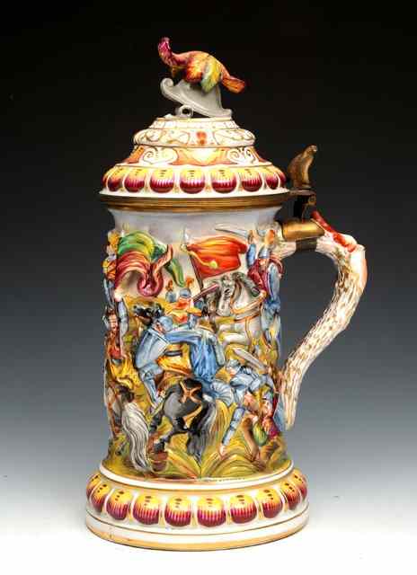 Appraisal: AN ITALIAN PORCELAIN LIDDED TANKARD with body moulded in light