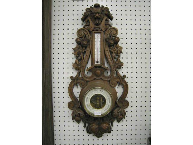 Appraisal: Black Forest Victorian Carved Wooden Barometer with thermometer lion head