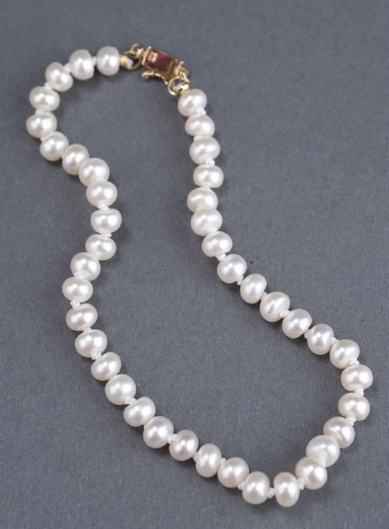 Appraisal: Freshwater pearl button bracelet The pearls are approximately x mm