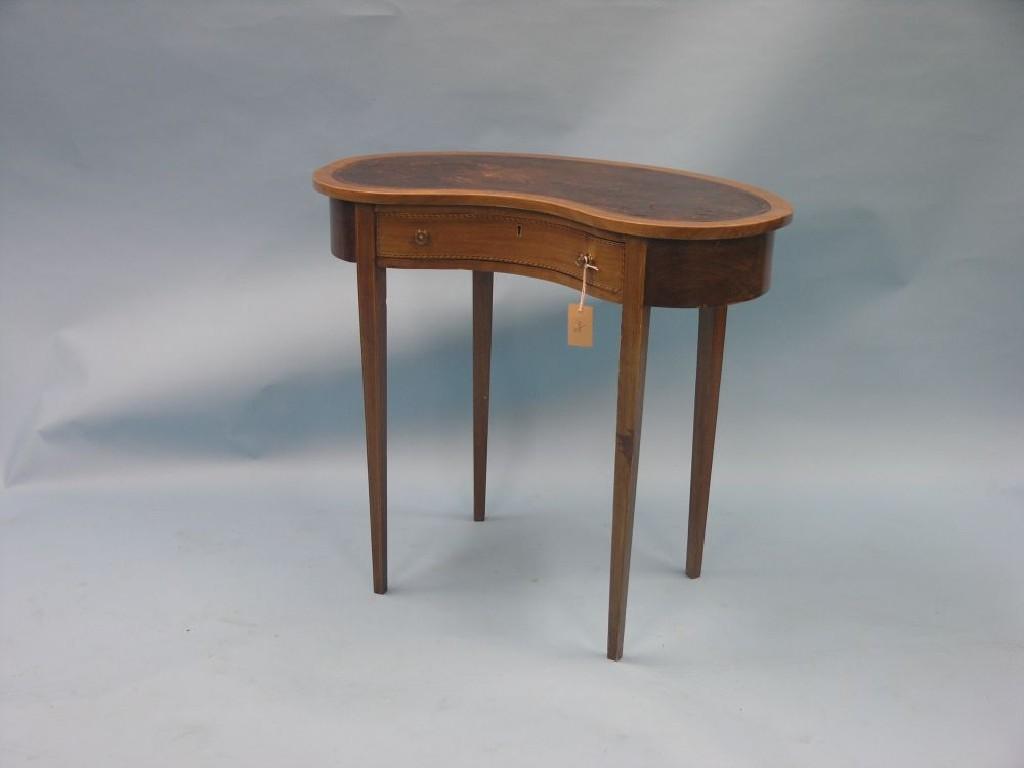 Appraisal: An Edwardian inlaid mahogany kidney-shaped writing table inset leather top