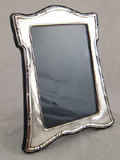 Appraisal: A silver photo frame with strut back x cm