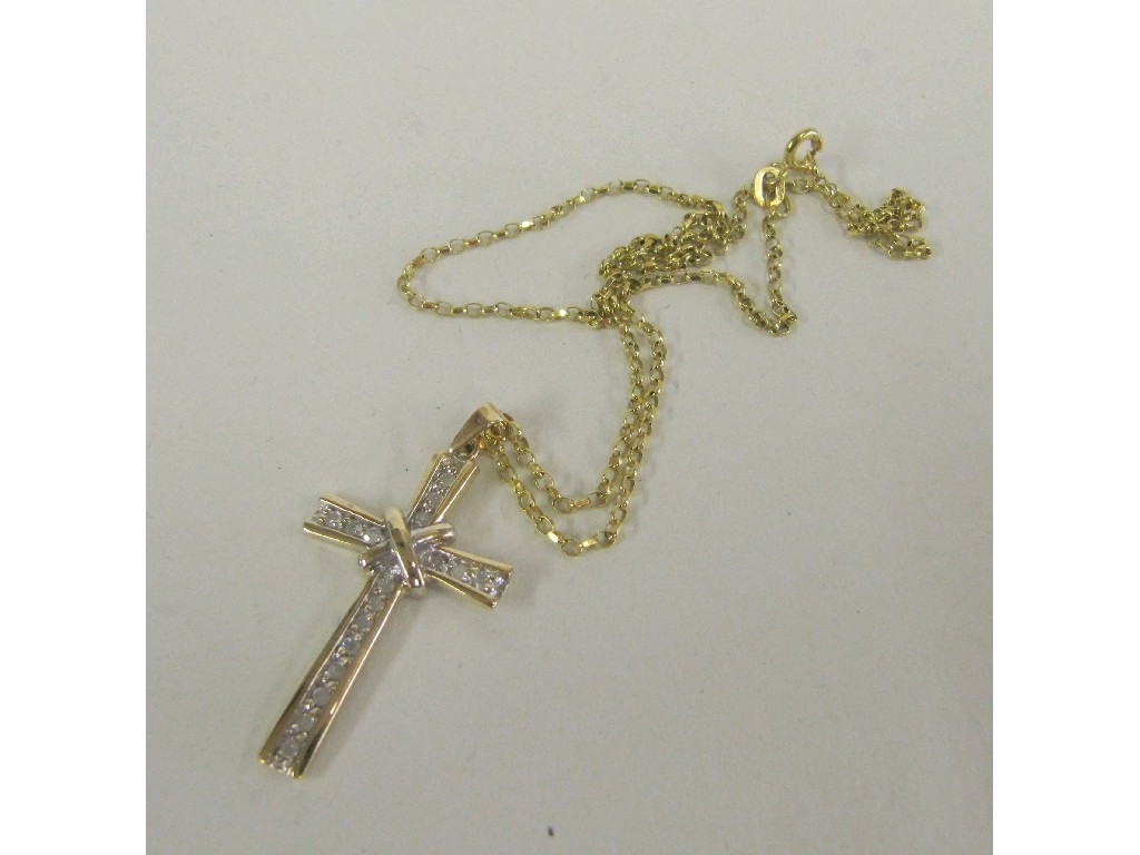 Appraisal: Nine carat gold diamond set cross pendant on ct gold