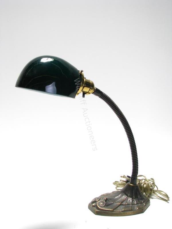 Appraisal: An antique desk lamp flex-arm brass base cased glass green