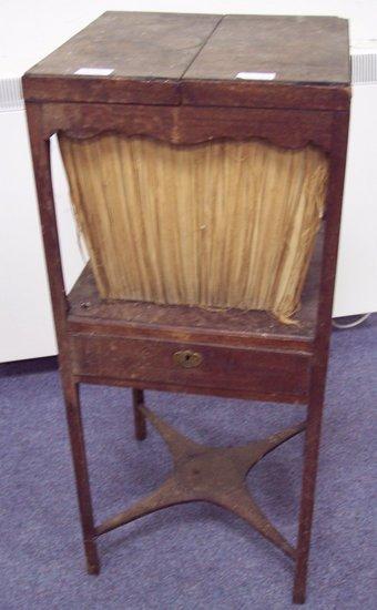 Appraisal: A George III mahogany square enclosed washstand the tier under