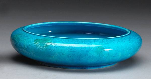 Appraisal: A large turquoise glazed porcelain shallow basin The compressed globular