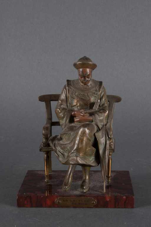 Appraisal: French painted spelter figure of a chinaman ''En Lecture'' Par