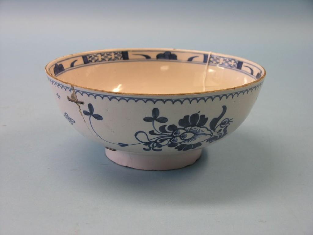 Appraisal: An th century tin-glazed earthenware fruit bowl primitively painted with