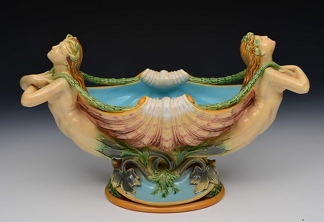 Appraisal: A MINTON MAJOLICA CENTREPIECE in the form of two stylised