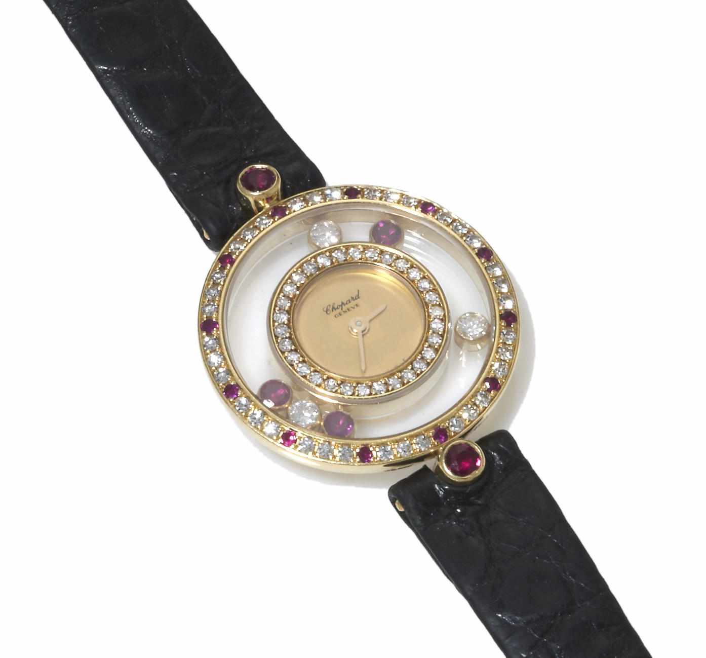 Appraisal: A diamond ruby and eighteen karat gold ''Happy Diamonds'' wristwatch