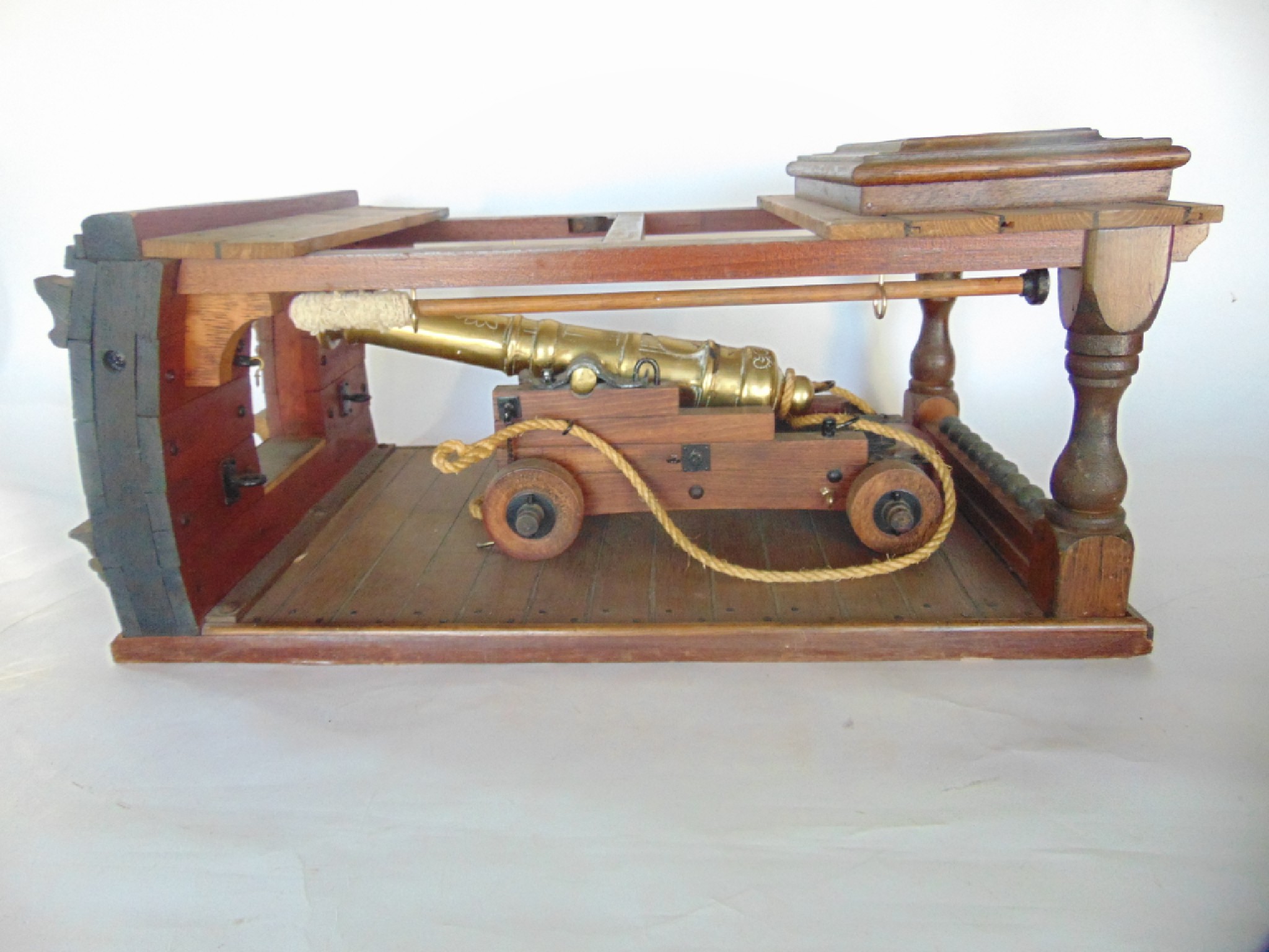 Appraisal: A highly detailed timber model of a timber galleon cannon