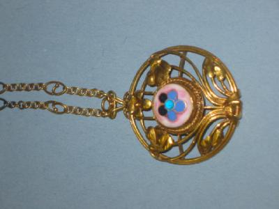 Appraisal: AN ARTS AND CRAFTS CT GOLD PENDANT of circular form