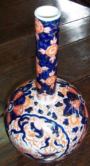 Appraisal: An Imari globe and shaft vase decorated various panels rosettes