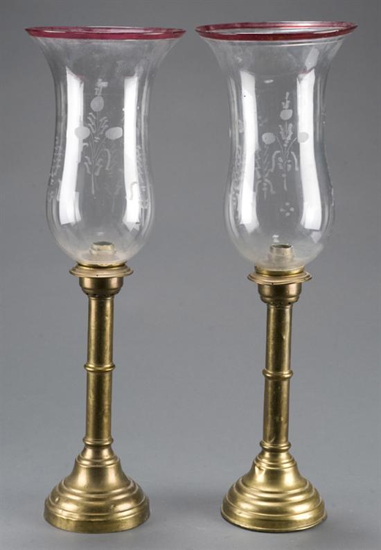 Appraisal: Pair of Russian brass candlesticks with etched glass shades Late