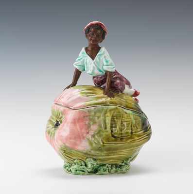 Appraisal: Figural Tobacco Jar of Black Boy on Melon ca 's