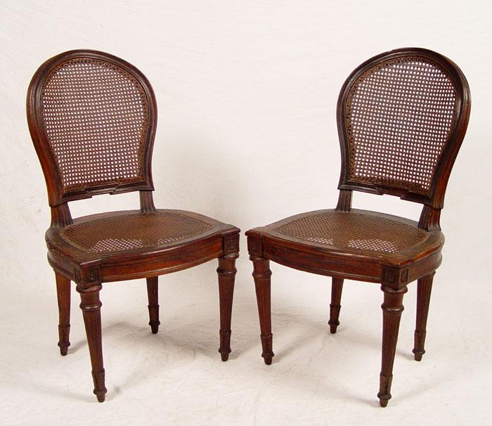 Appraisal: PAIR LOUIS XVI STYLE CHAIRS Natural wood finish with deep