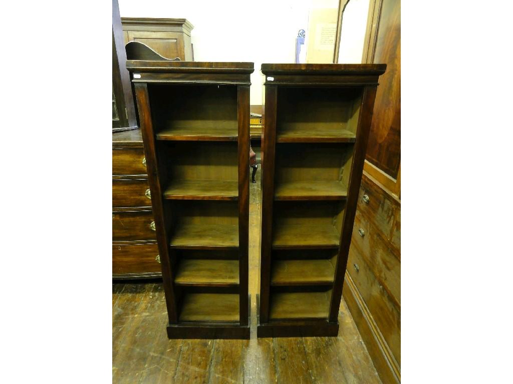 Appraisal: A pair of small mahogany freestanding open bookcases enclosing adjustable