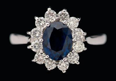 Appraisal: Sapphire diamond ring central oval sapphire estimated weight cts surrounded