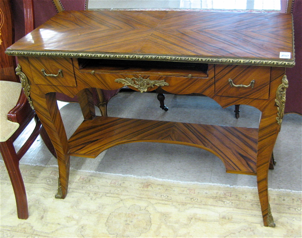 Appraisal: LOUIS XV STYLE ORMOLU-MOUNTED KINGWOOD WRITING TABLE having a long