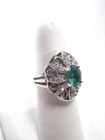 Appraisal: K white gold lady's emerald and diamond dome ring emerald