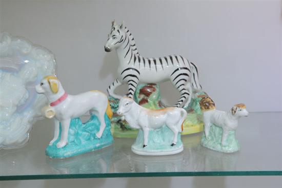 Appraisal: A STAFFORDSHIRE ZEBRA FIGURINE TOGETHER WITH TWO DOGS AND A