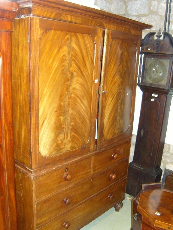 Appraisal: A Regency mahogany linen press the base fitted with long