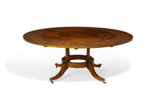 Appraisal: A JUPE STYLE THUYA WOOD EXTENDING CIRCULAR DINING TABLE A