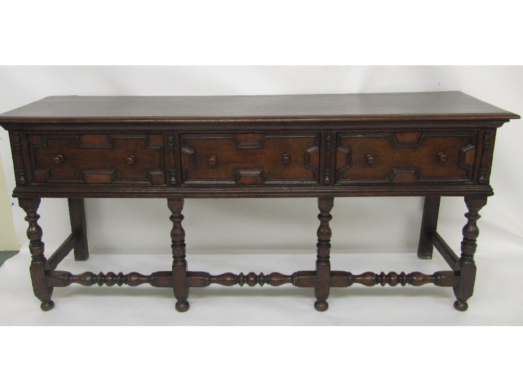 Appraisal: An th Century oak low dresser the three drawers with