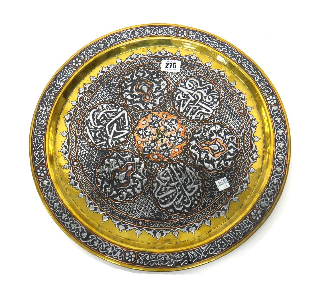 Appraisal: A brass circular dish with silver and copper inlay possibly