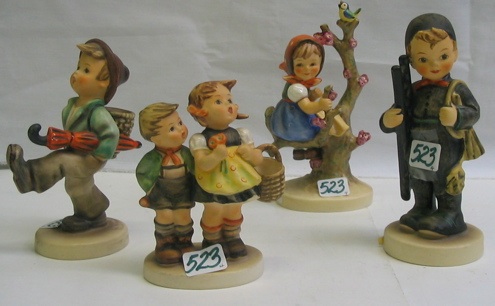 Appraisal: A GROUP OF GERMAN HUMMEL FIGURES Globe Trotter HUM in