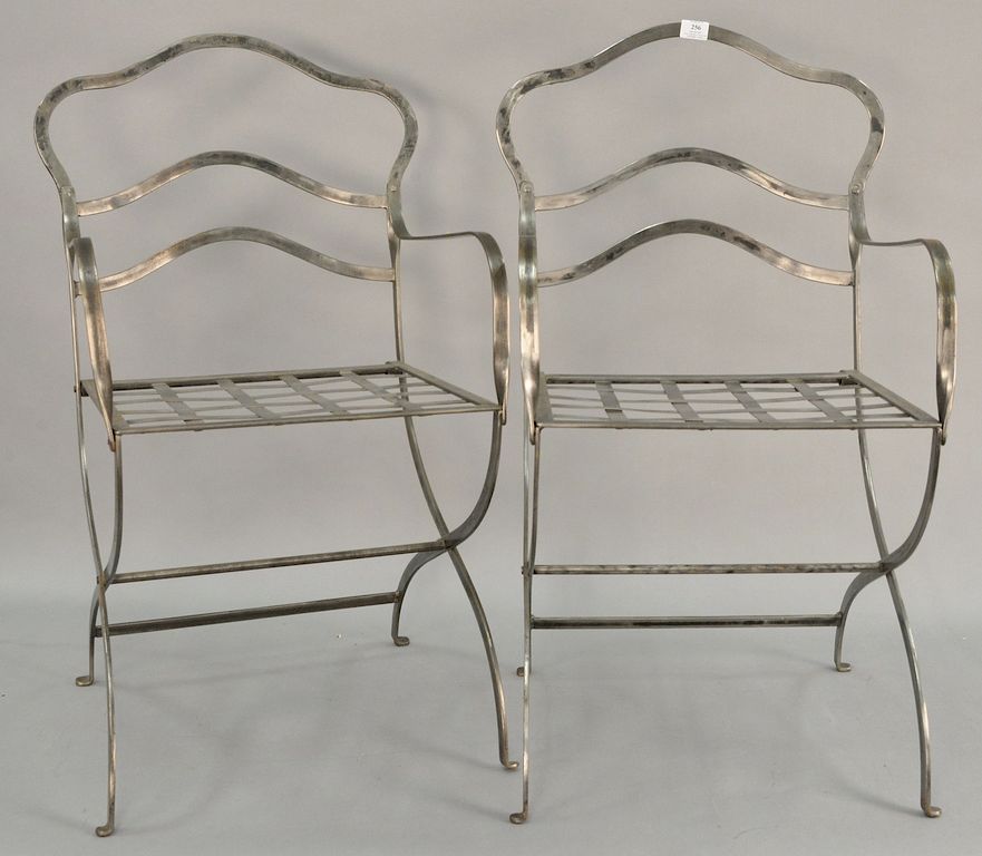 Appraisal: Pair of contemporary polish metal armchairs Pair of contemporary polish