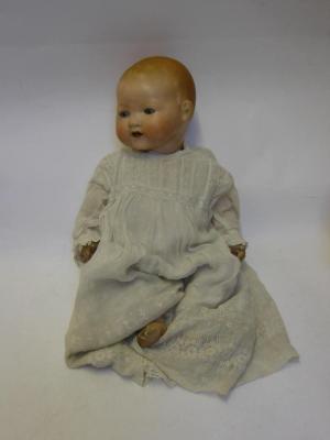 Appraisal: An Armand Marseille bisque head baby doll with blue glass