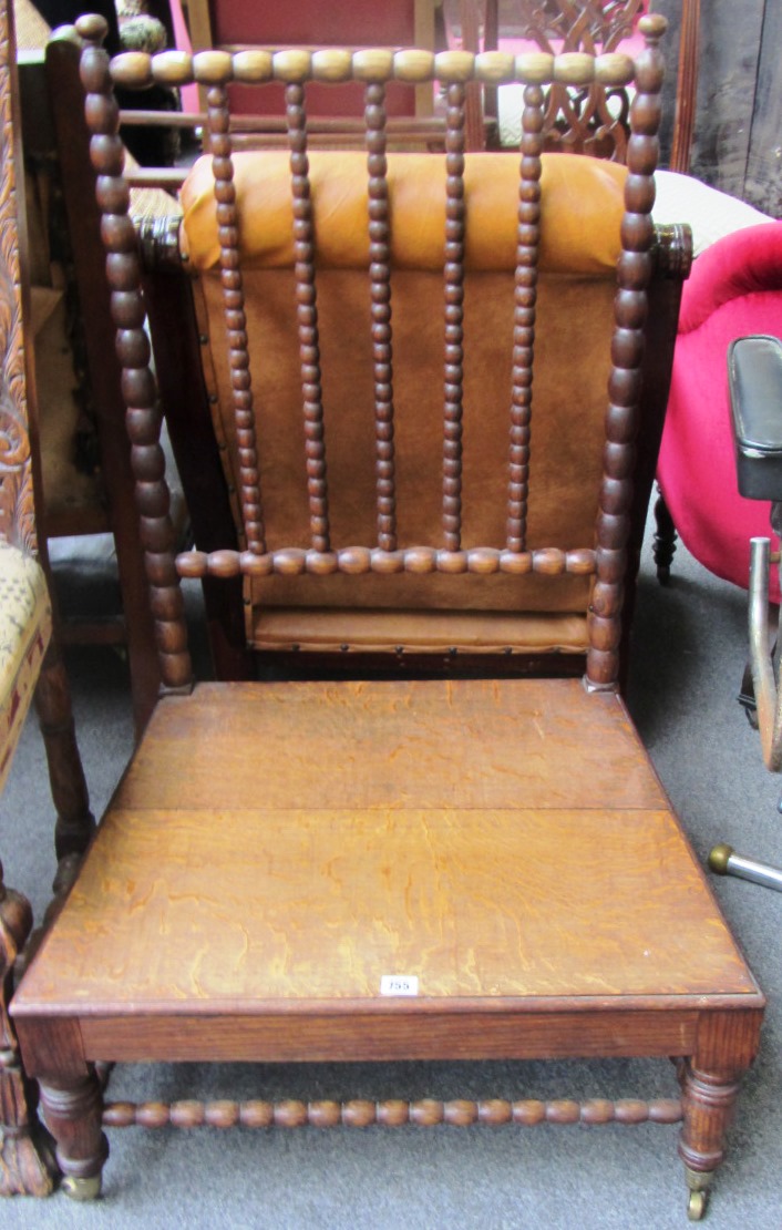 Appraisal: A th century oak side chair with bobbin turned decoration