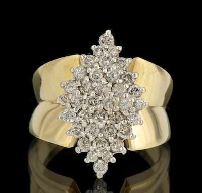 Appraisal: A Ladies' Diamond Cluster Ring k yellow gold ring featuring