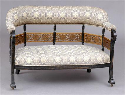 Appraisal: AESTHETIC MOVEMENT EBONIZED SETTEE The upholstered back with canted corners