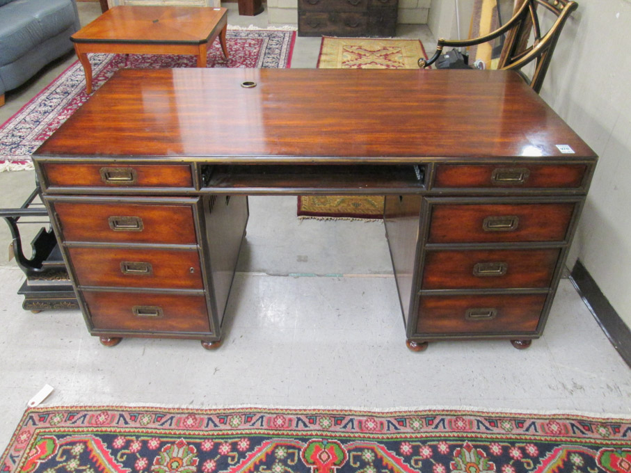 Appraisal: CAMPAIGN STYLE DESK AND CHAIR Theodore Alexander Furniture Co Hickory