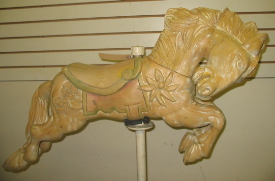 Appraisal: CARVED PINE CAROUSEL HORSE ON STAND The diminutive jumper horse