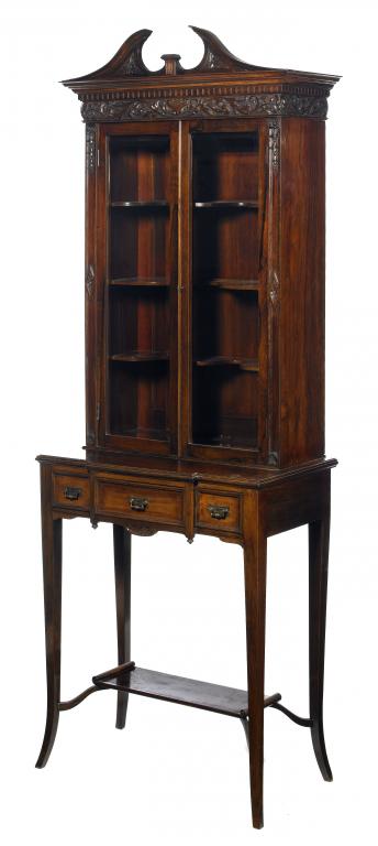 Appraisal: A SCOTTISH VICTORIAN CARVED ROSEWOOD CABINET the swan-neck pediment above