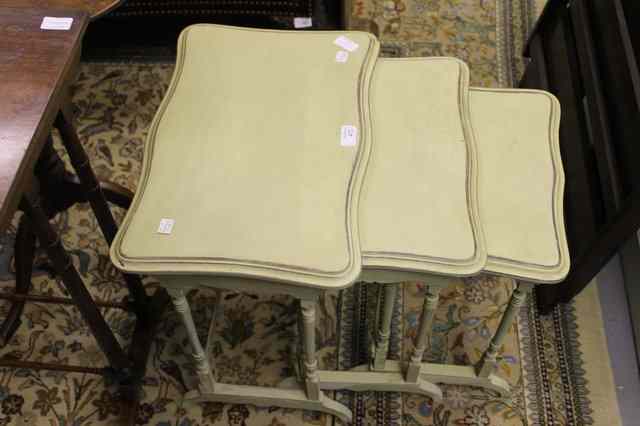 Appraisal: A CREAM PAINTED NEST OF THREE OCCASIONAL TABLES wide