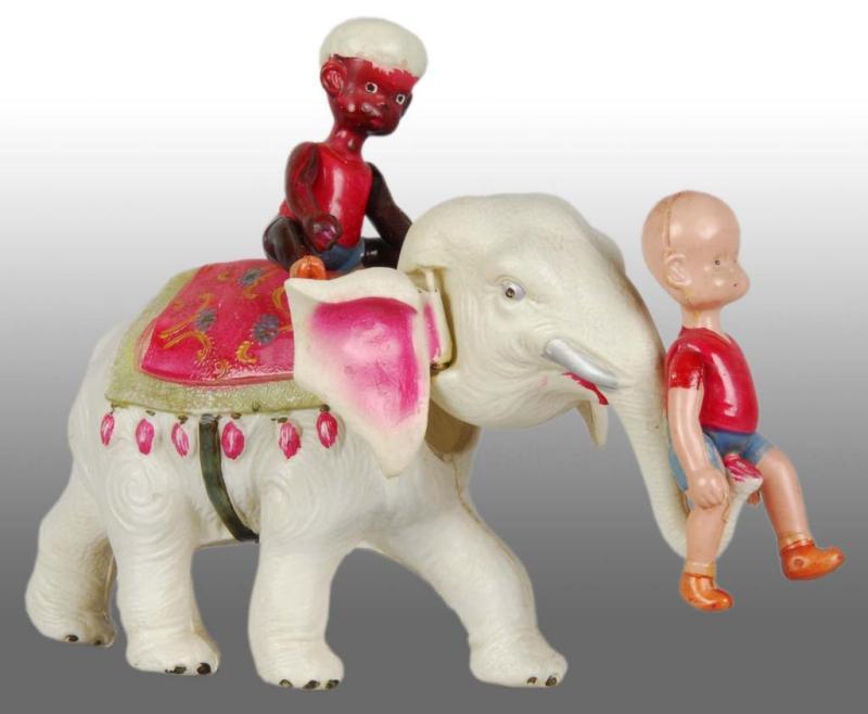 Appraisal: Celluloid Henry on Elephant Wind-Up Toy Description Japanese Pre-war Marked